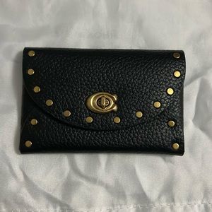 Coach card case with rivets
